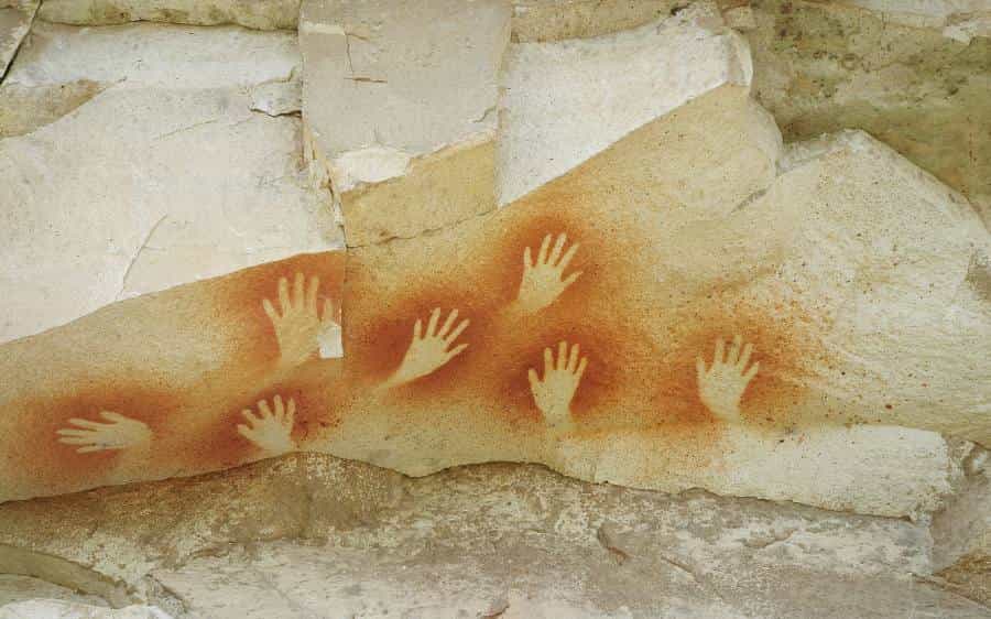 Symbolbild: Symbole. Handabdrücke, Höhlenmalerei.